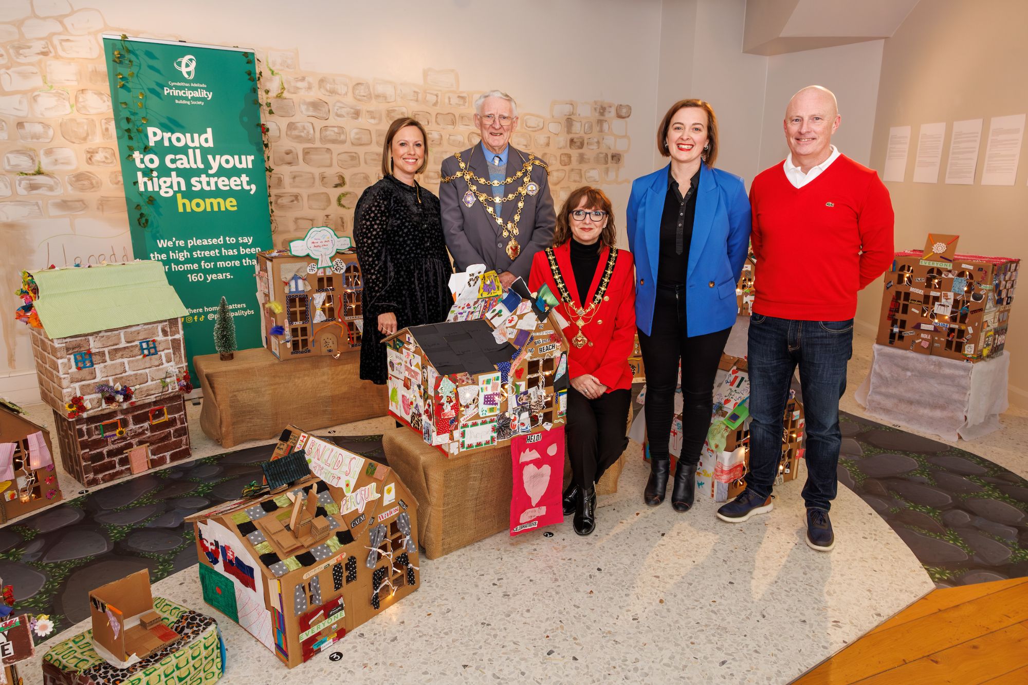 Principle members of Principality Building Society, Dragon Mascot and Head of Theatre Gemma Durham at the Roots and Roofs Exhibition