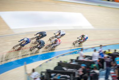 Mix of cyclists on an indoor cycling track